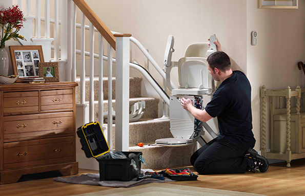 Stairlift instalation Stannah engineer installing stairlift Siena