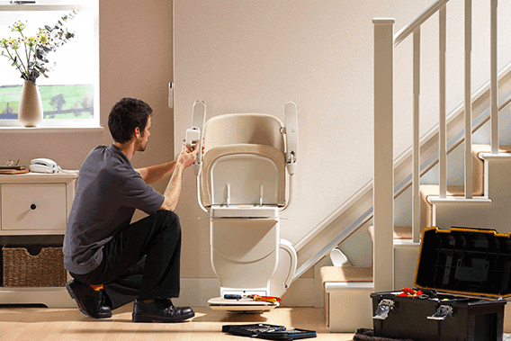 siena stairlift at bottom with ivory upholstery