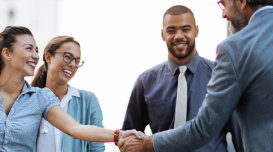 People shaking hands in a business environment