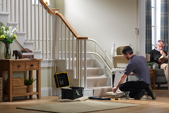 stairlift repairs with toolbox and engineer